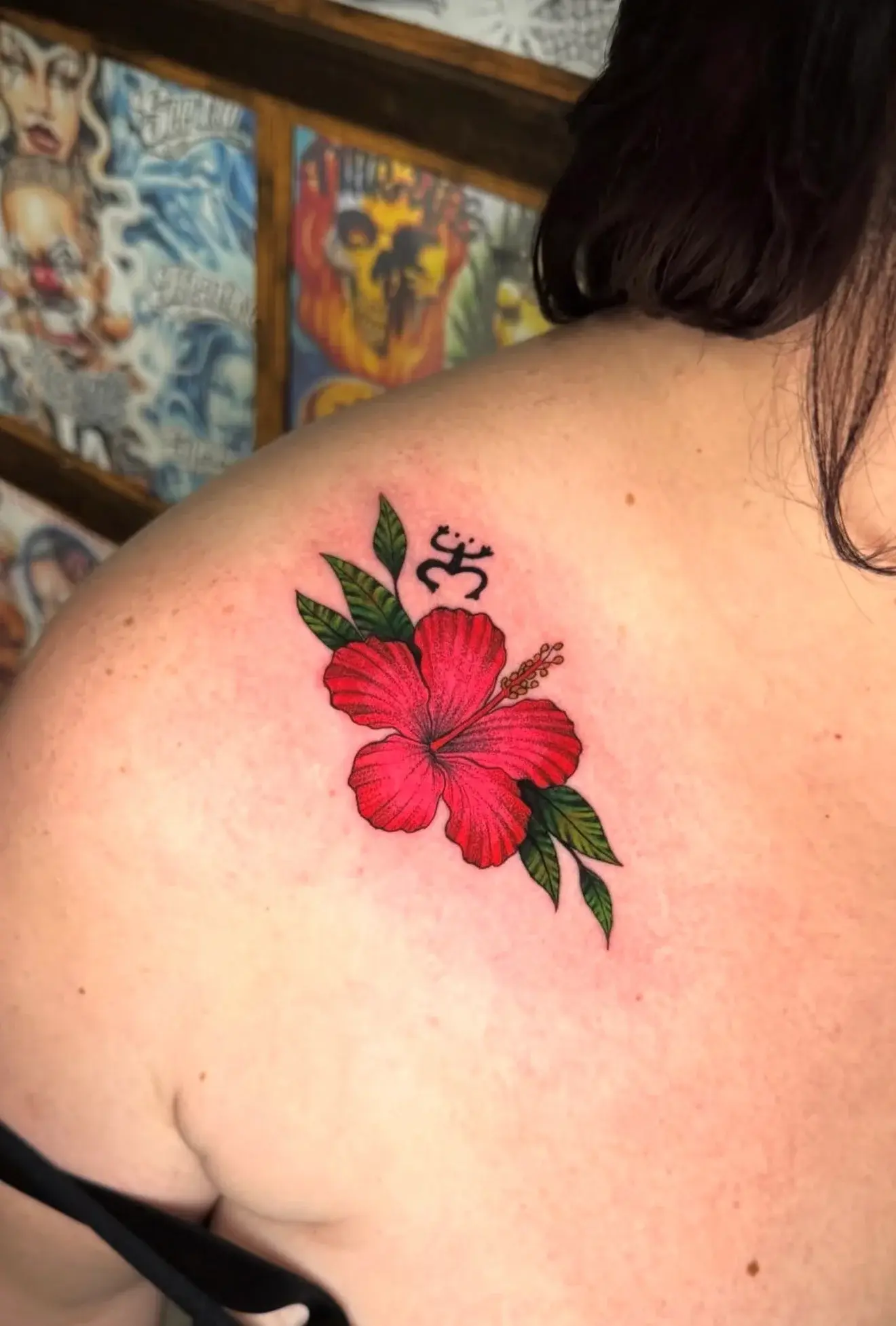 Red hibiscus flower tattoo by Lucia