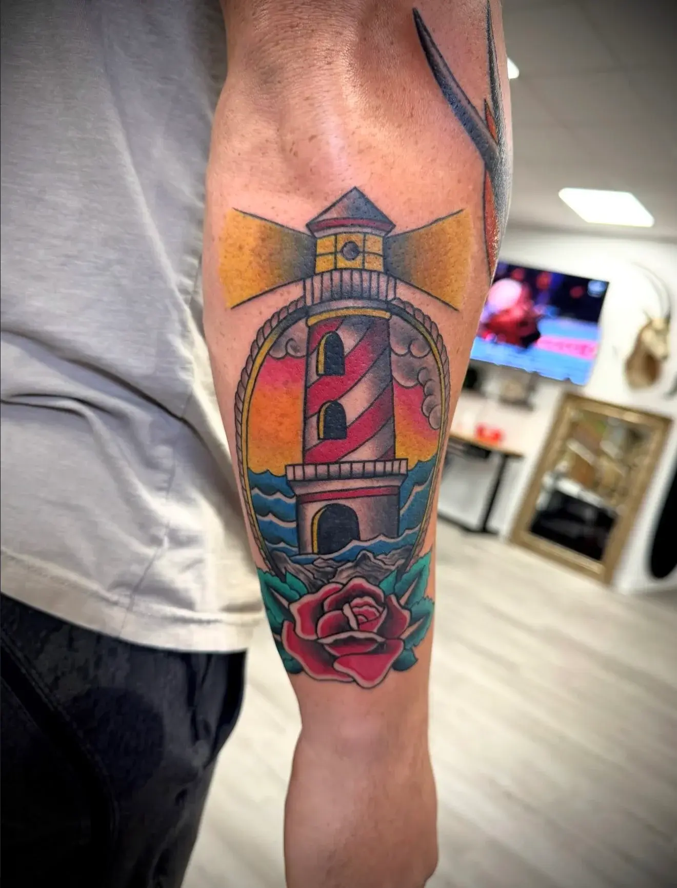 Color lighthouse and rose tattoo by Marcos